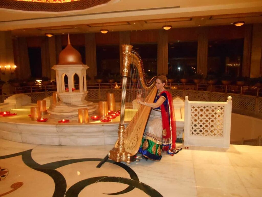 Harpist Esther Underhay performs at Taj Mahal Hotel, New Delhi, India